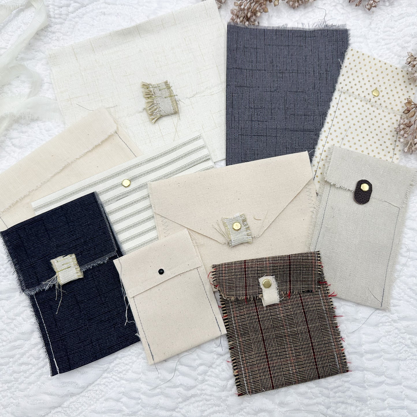 Rough Sewn Fabric Pockets and Signature Pages in Neutral Colors