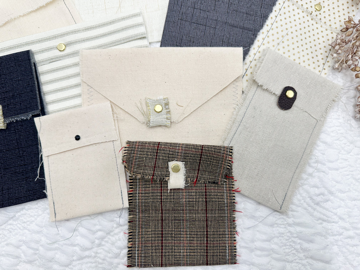 Rough Sewn Fabric Pockets and Signature Pages in Neutral Colors